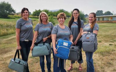 1st Interstate Bank Volunteers Make Backpacks with Items for Mothers